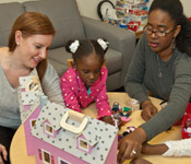 Therapist Sara Anderson and family in the new therapy office