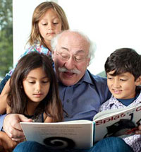 Meisels reading to several of his grandchildren