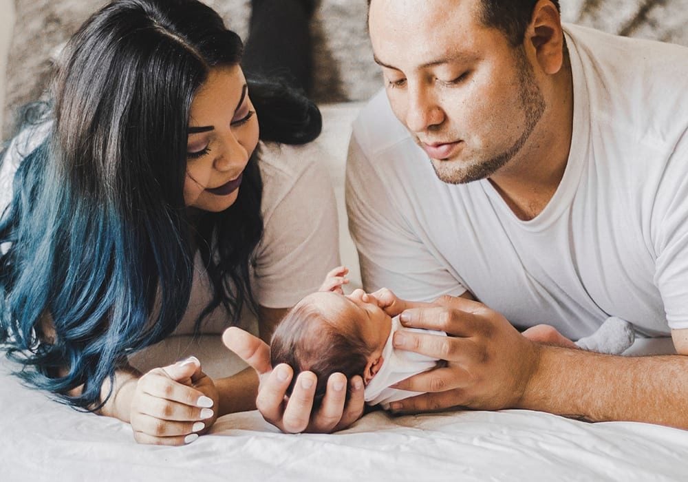 mother and father with infant