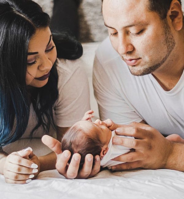 mother and father with infant