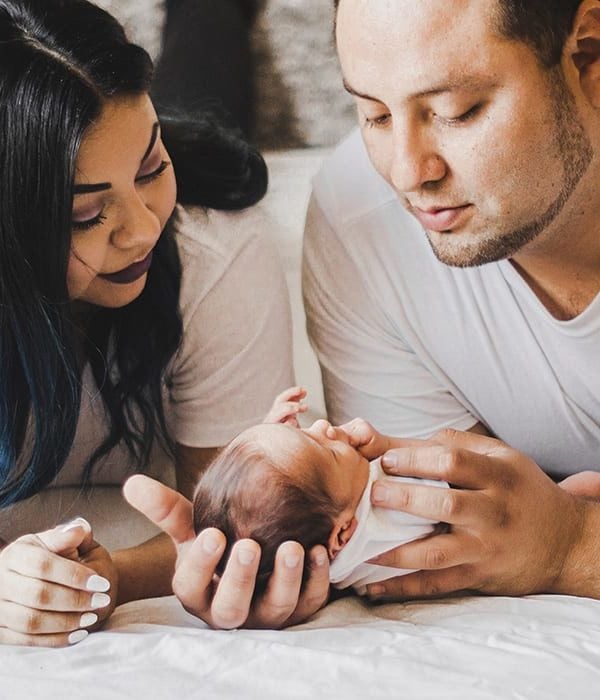 mother and father with infant