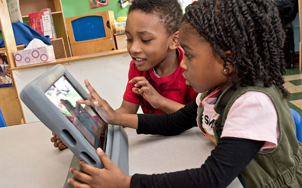 Children with a tablet