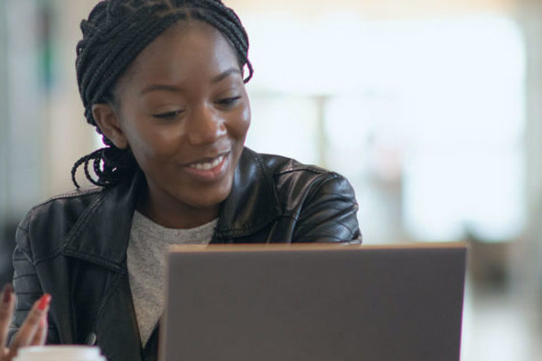 female student at laptop applying for admissions