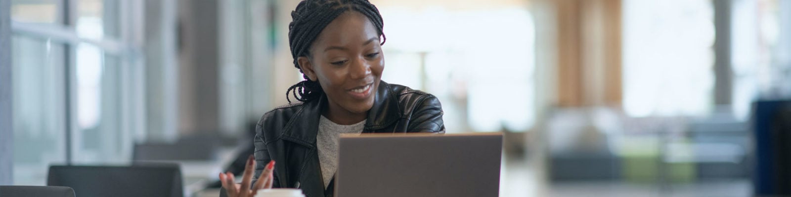 female student at laptop applying for admissions