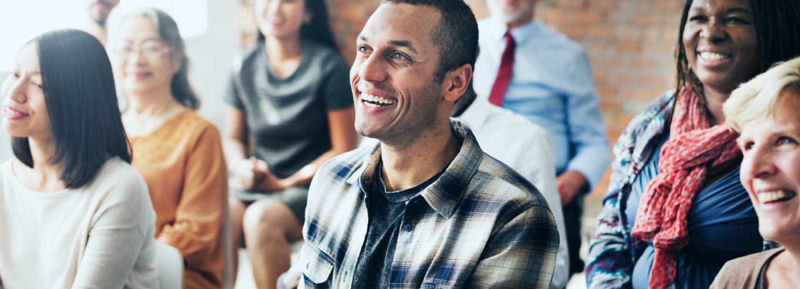 Classroom of smiling students.