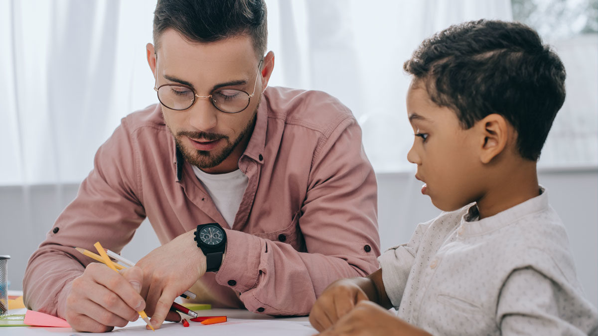 Man teaching child