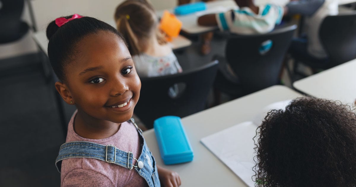 Cute Child In Classroom