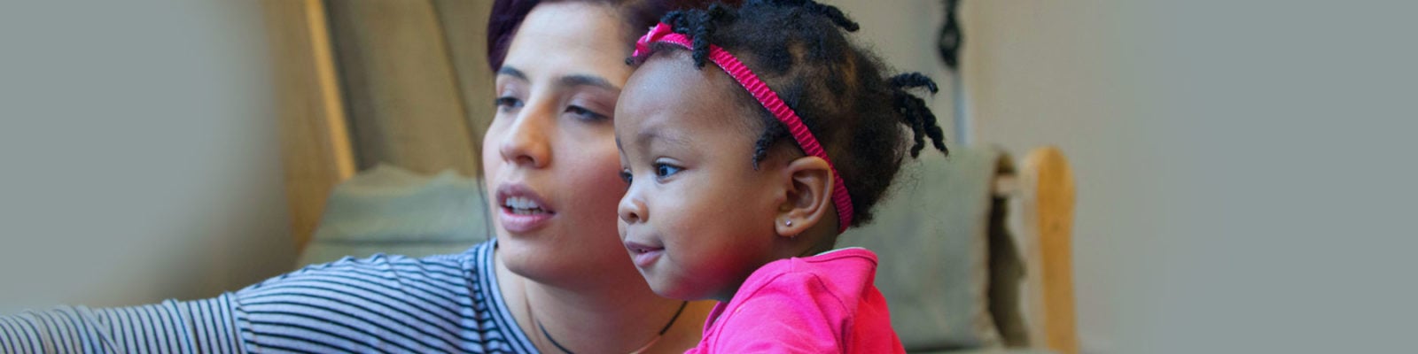 Child development specialist working with a toddler.