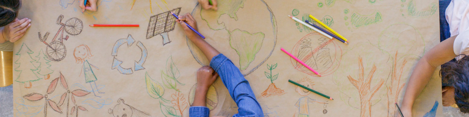 International Students Kids Drawing At A Table