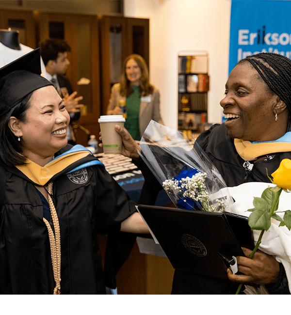 Erikson graduates celebrate at the 2025 Commencement ceremony held at the Goodman Theater in Chicago.