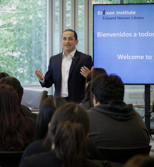 David Rojas of Alliance 98 speaks to youth from Little Village visiting Erikson.