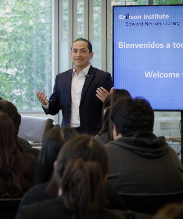 David Rojas of Alliance 98 speaks to youth from Little Village visiting Erikson.