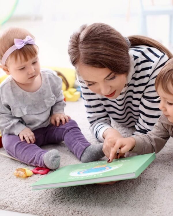 Early childhood professional working with a toddler in a home setting as part of an early intervention visit.