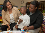 Teacher, parent, and student working together at a Child-Parent Center