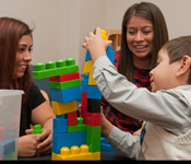 Alumni Rios working with a family.